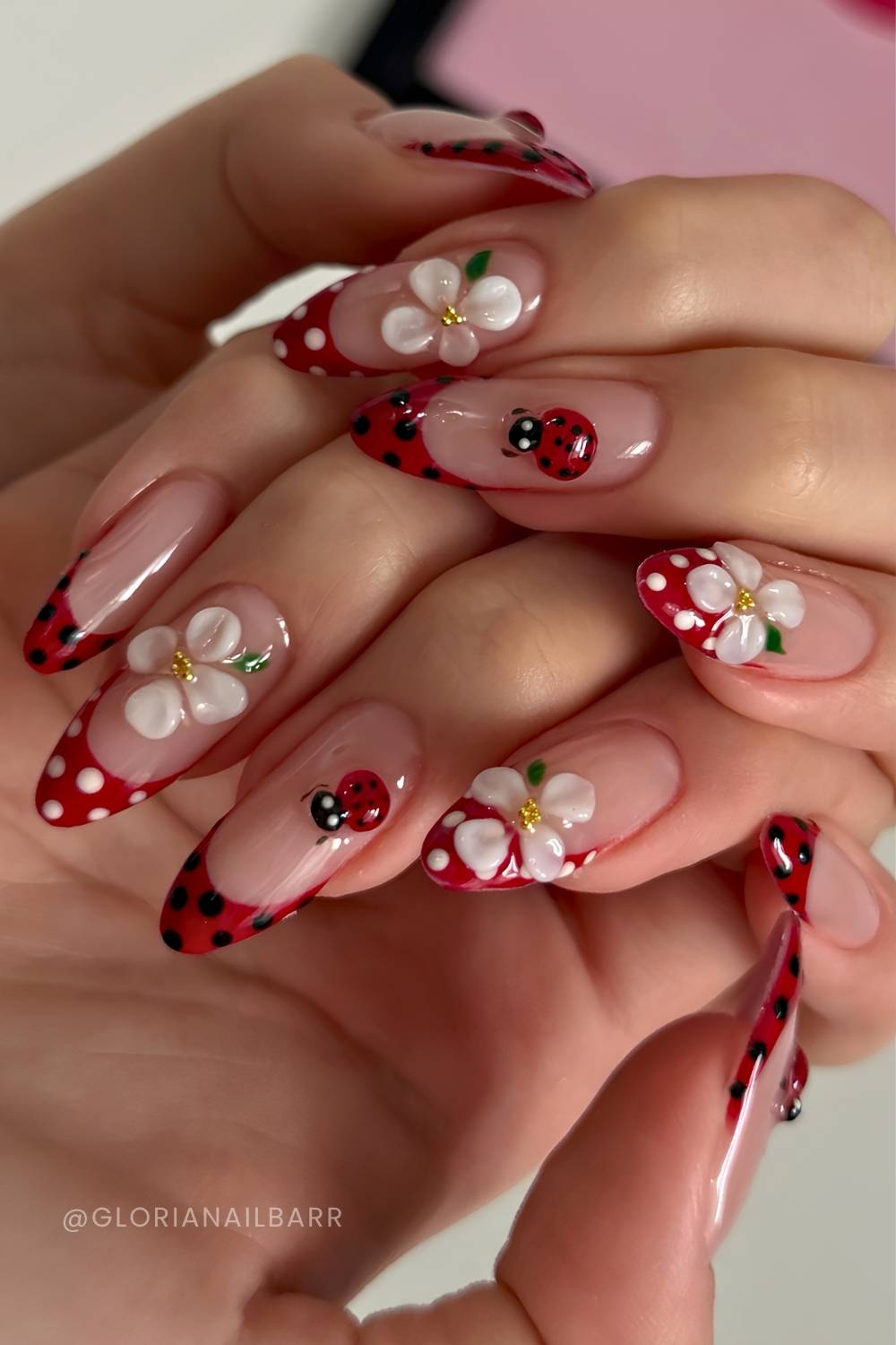 Dotted red French nails with ladybug and daisies