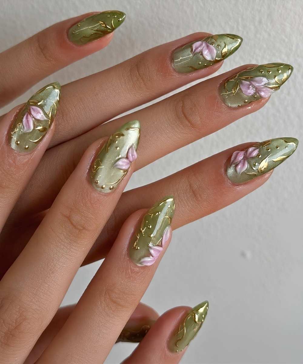 Green cat eye mani with pink flowers and gold accents
