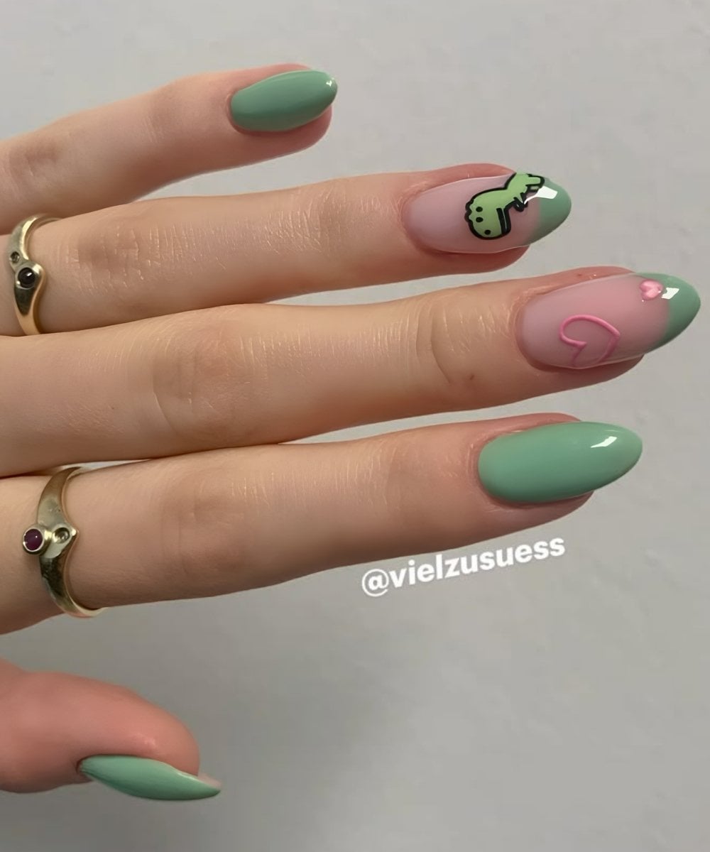 Green nails with dinosaur art