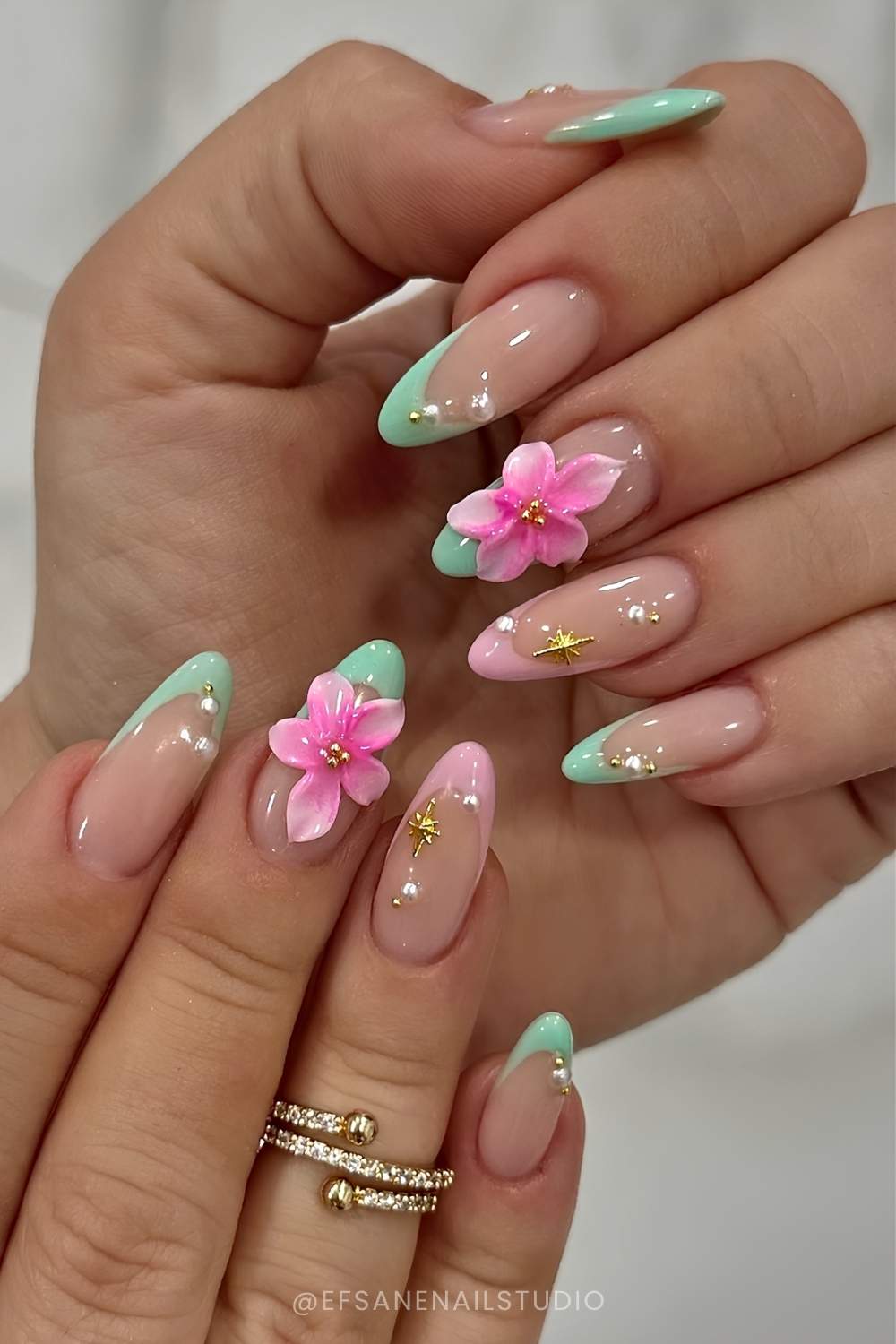 Pastel green french manicure with 3d pink flowers