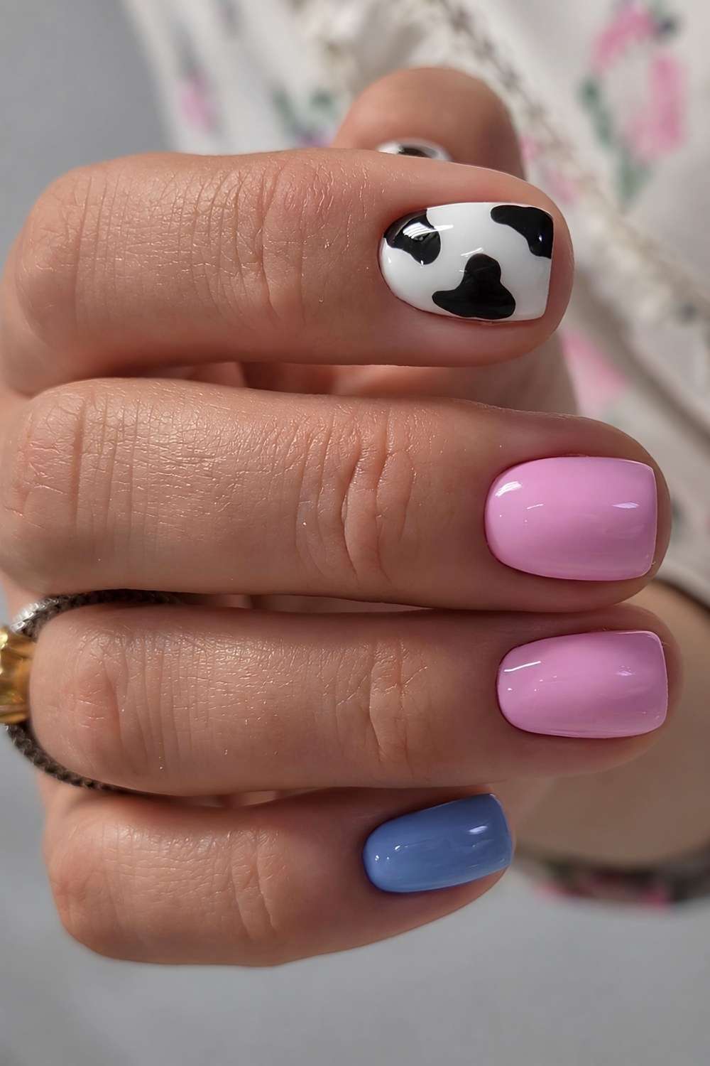 Pink and blue nails with cow print