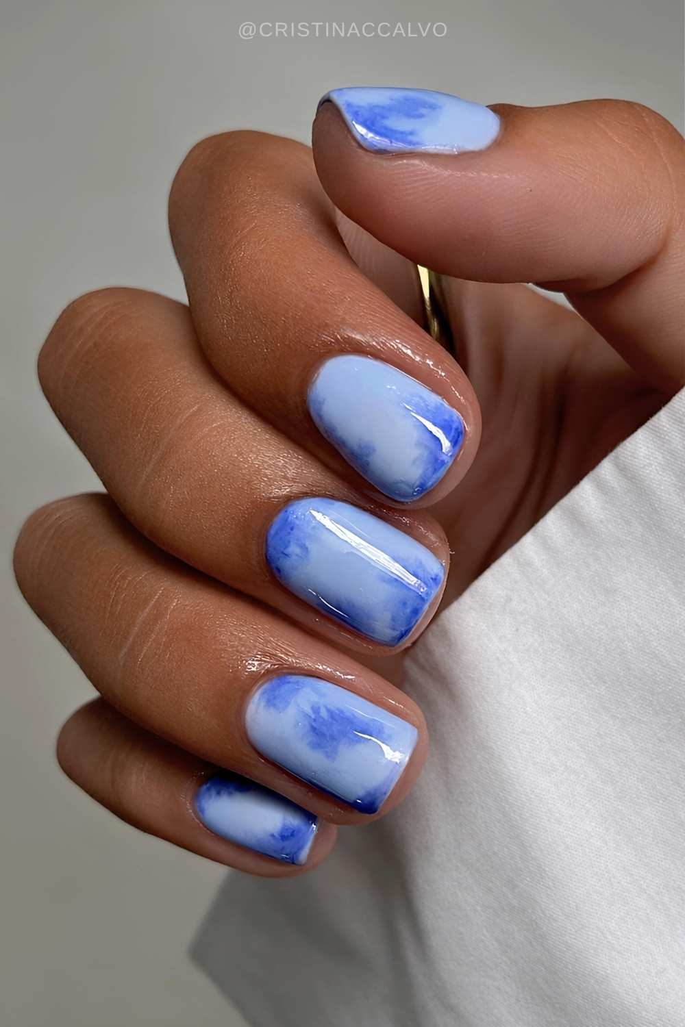 Short blue on blue marble nails