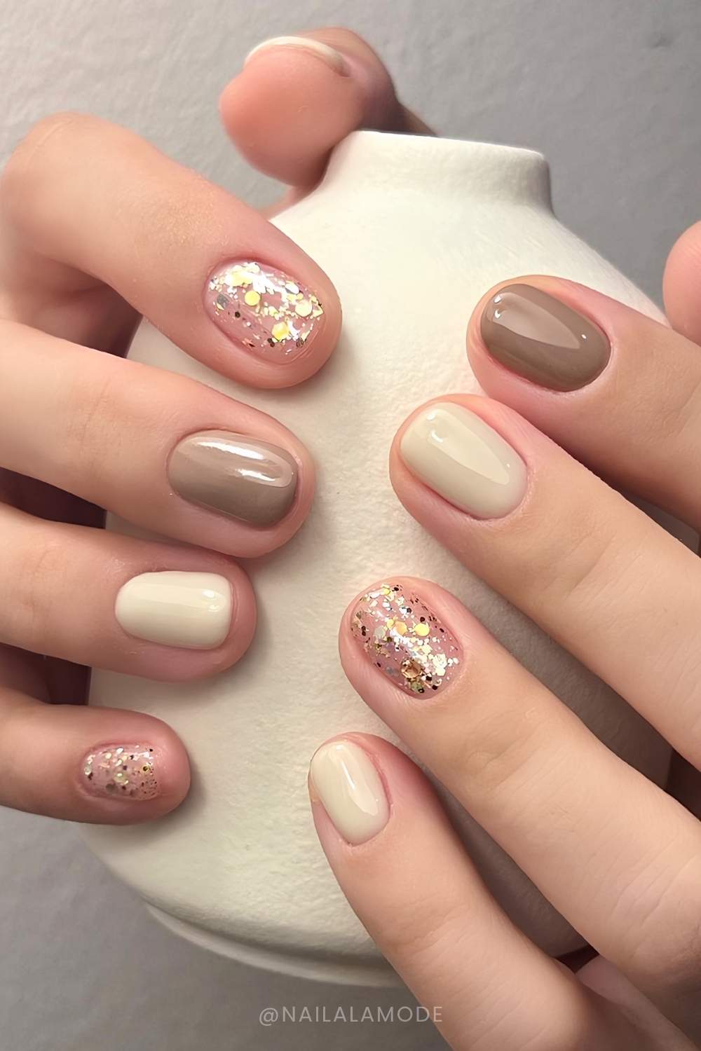 Taupe and vanilla nails with chunky glitter