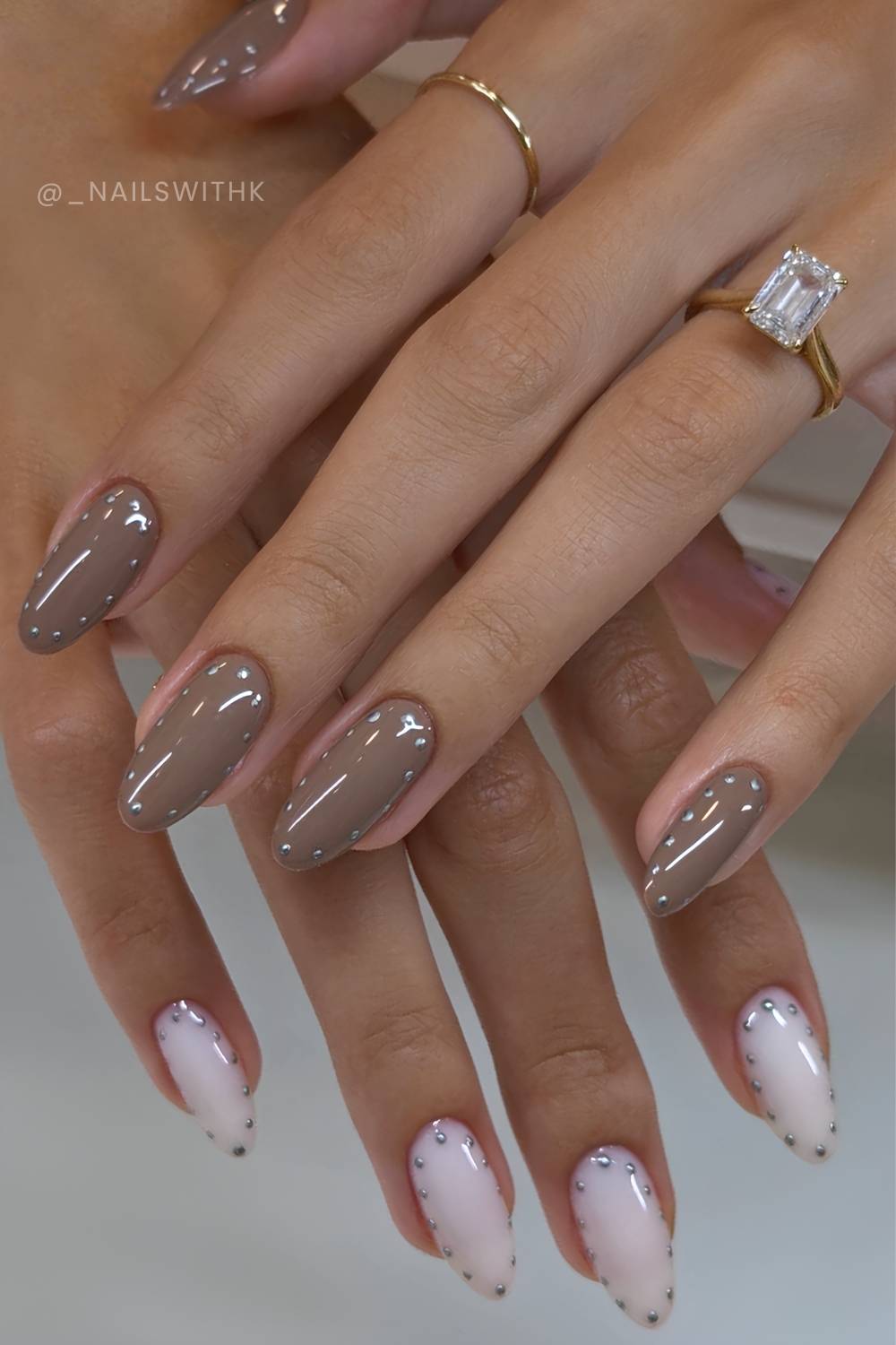 Taupe and white nails with silver dotted outline