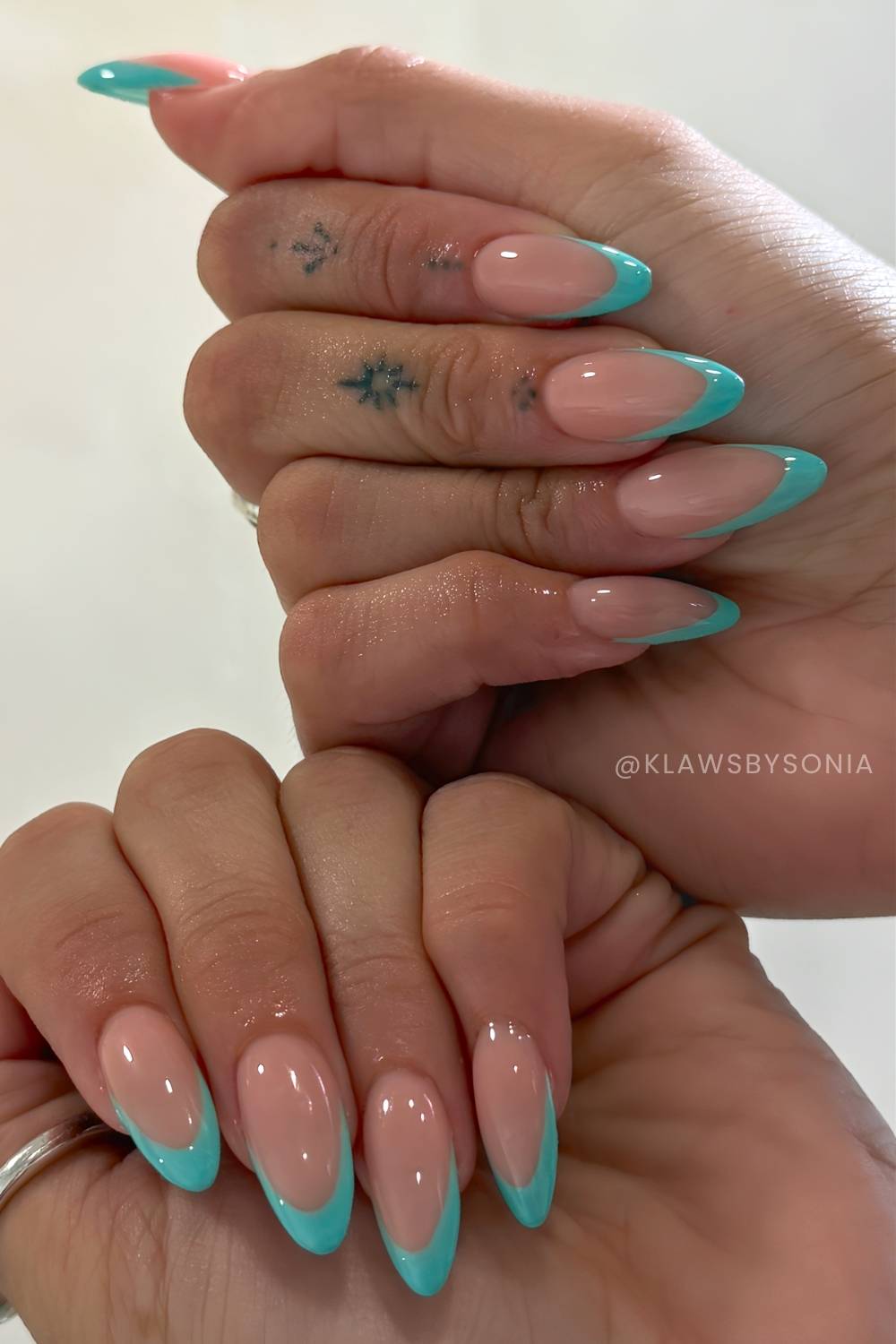 Teal French tip nails