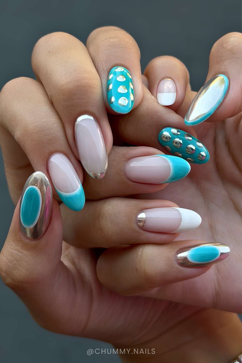 Teal nails with metallic silver accents