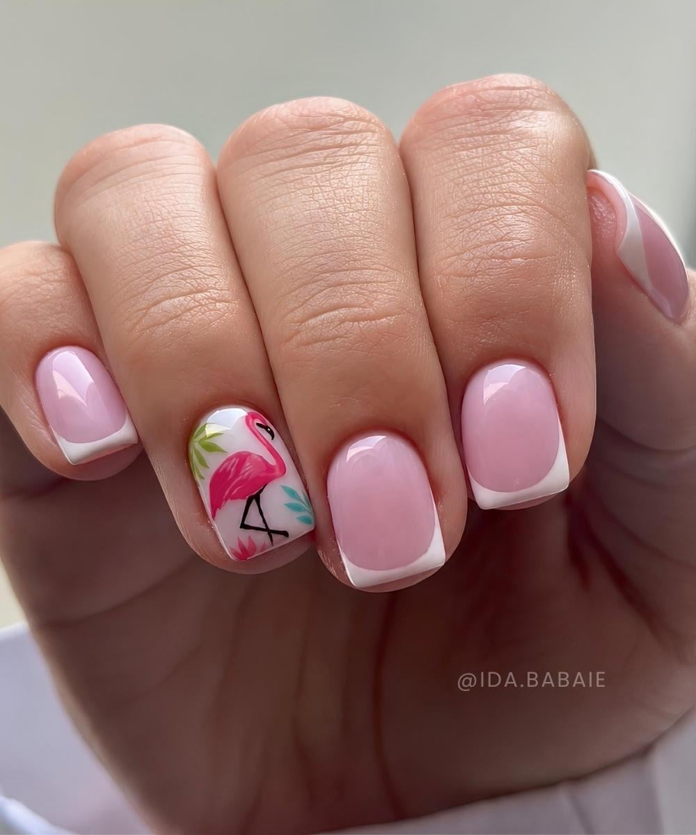 White French nails with pink flamingo art