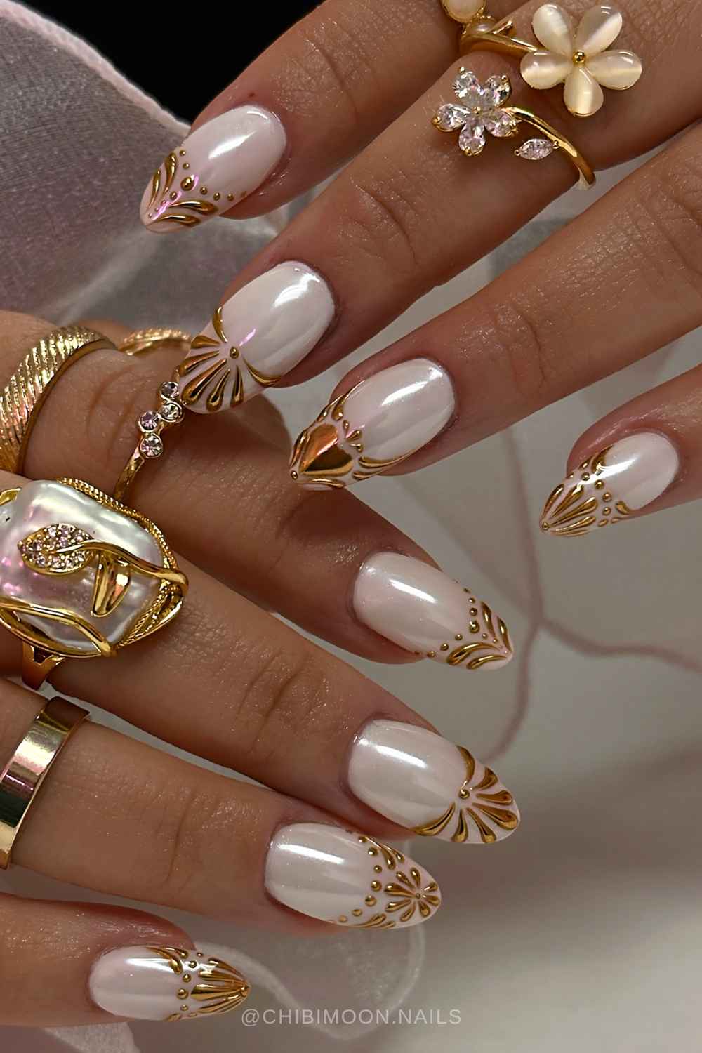 White nails with baroque inspired gold French tips