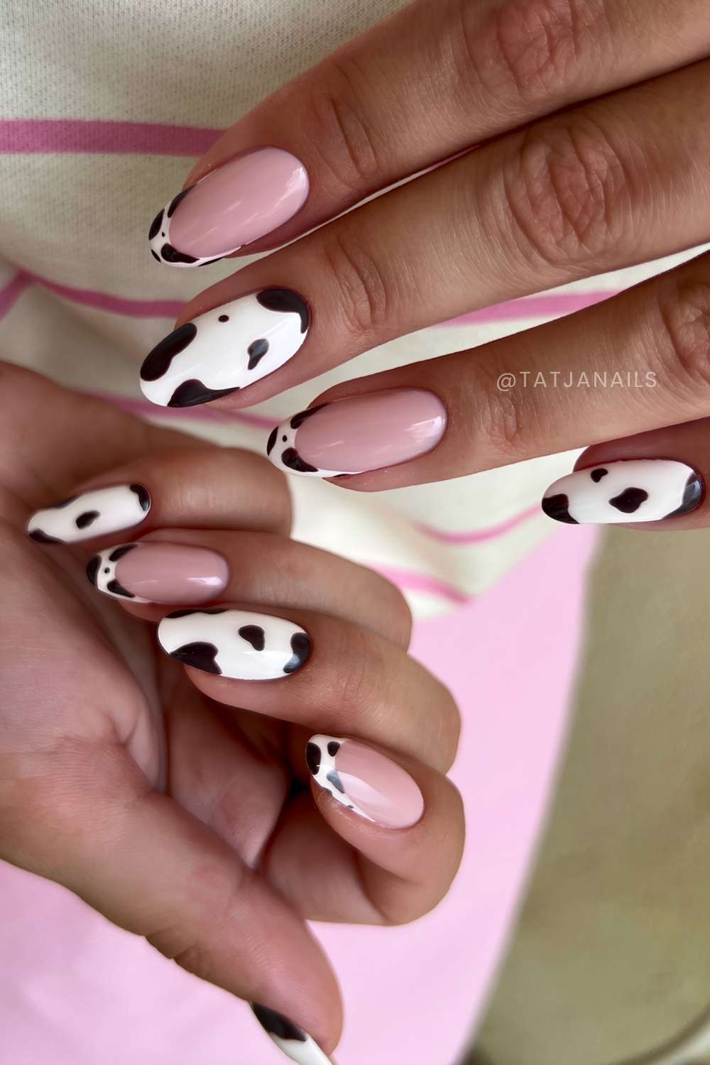 White nails with black cow print spots