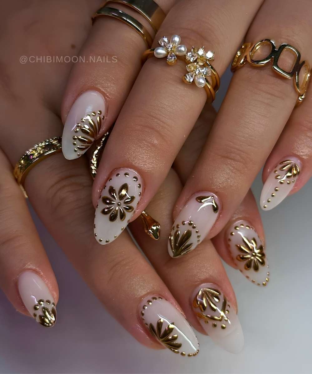 White nails with gold petal elements