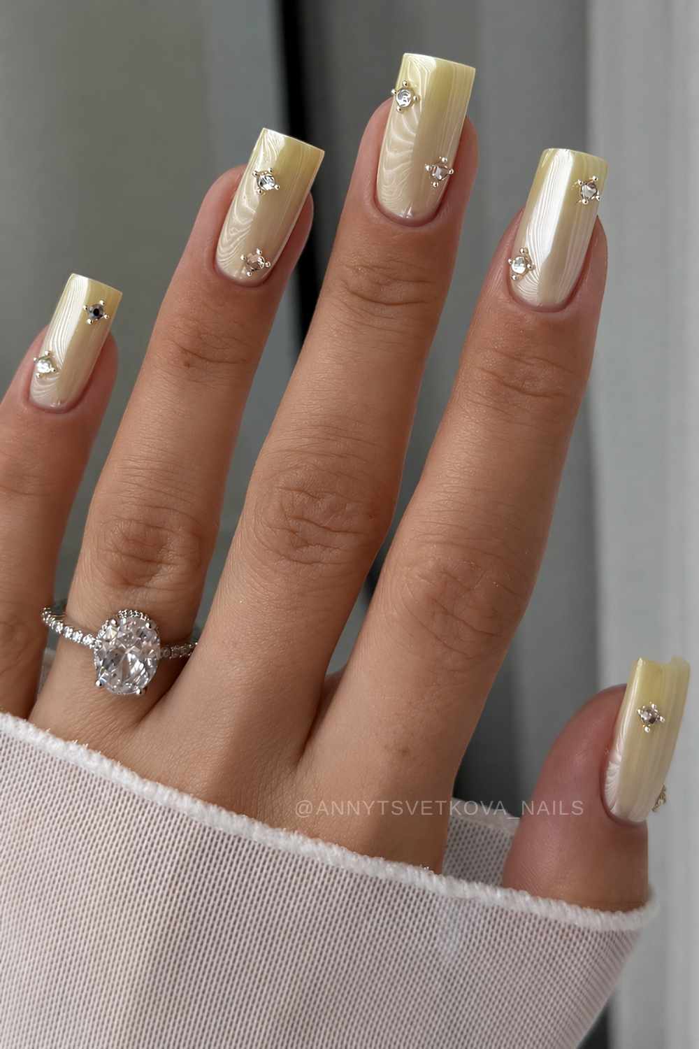 Yellow chrome nails with rhinestones