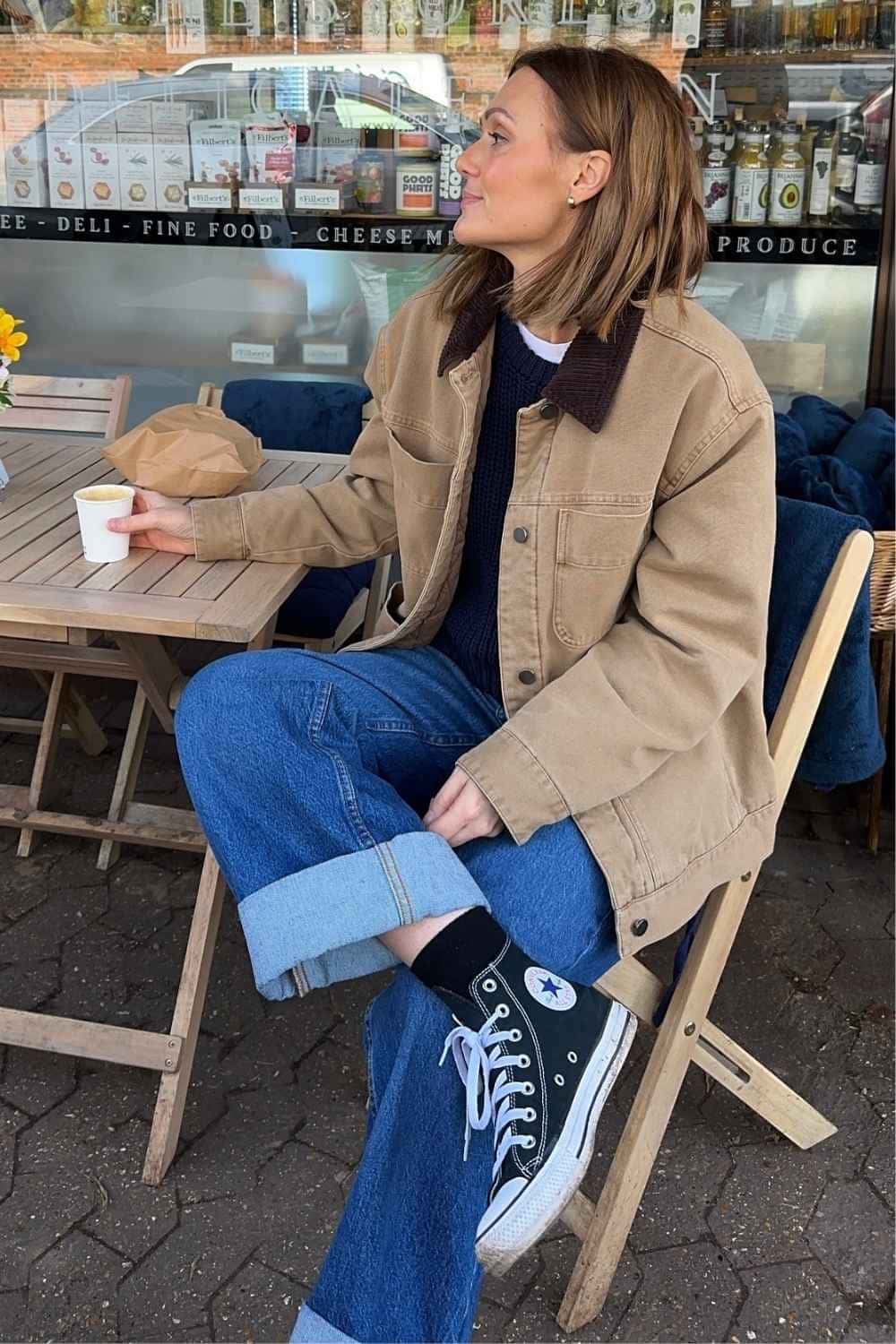 Barn jacket with blue jeans and black converse