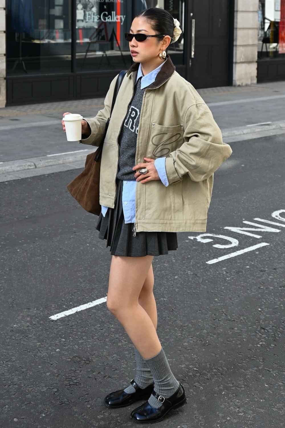 Barn jacket with pleated mini skirt and gray socks