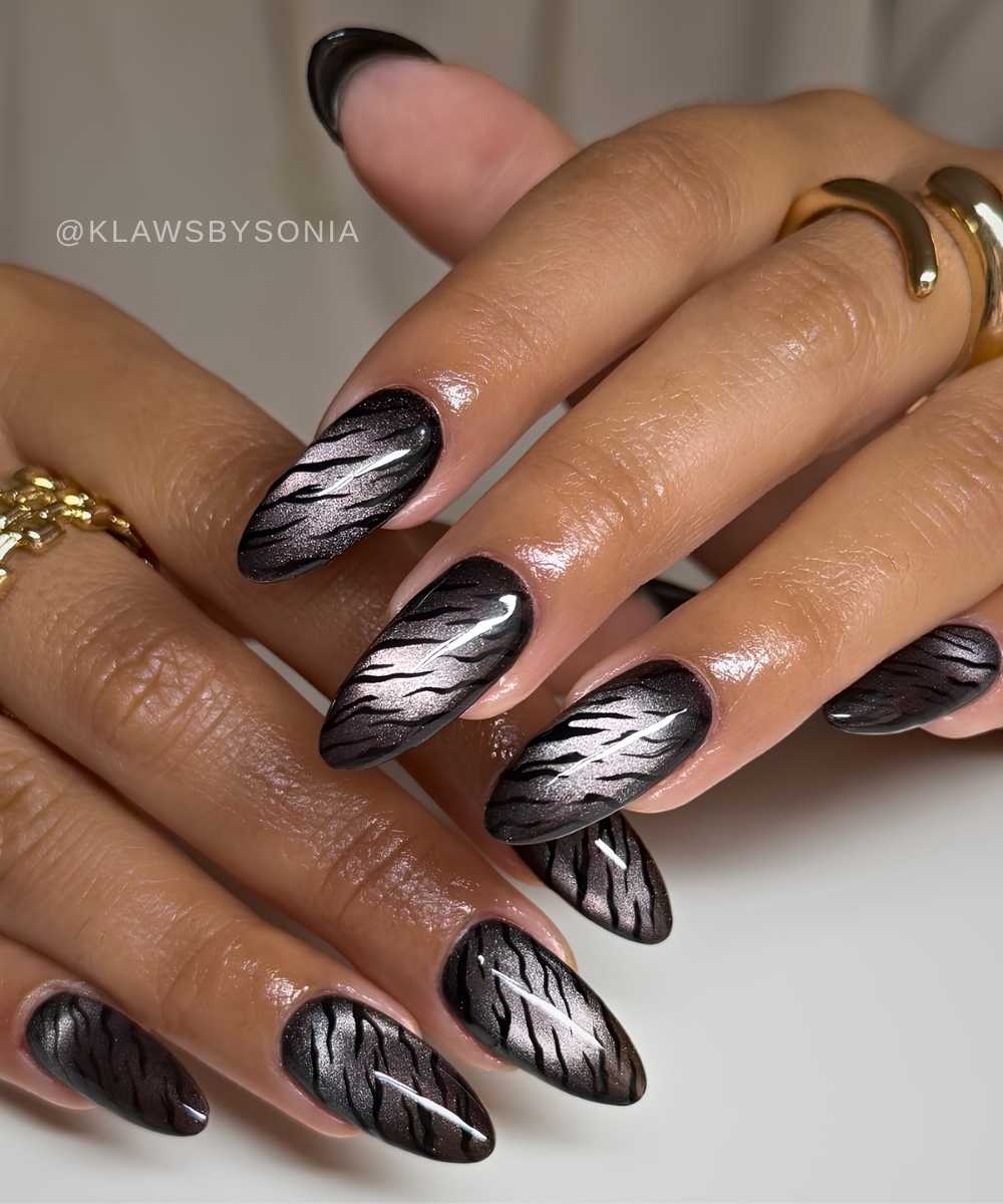 Black cat eye nails with animal print