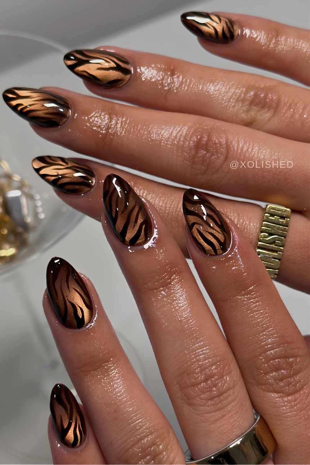 Brown cat eye nails with tiger stripes