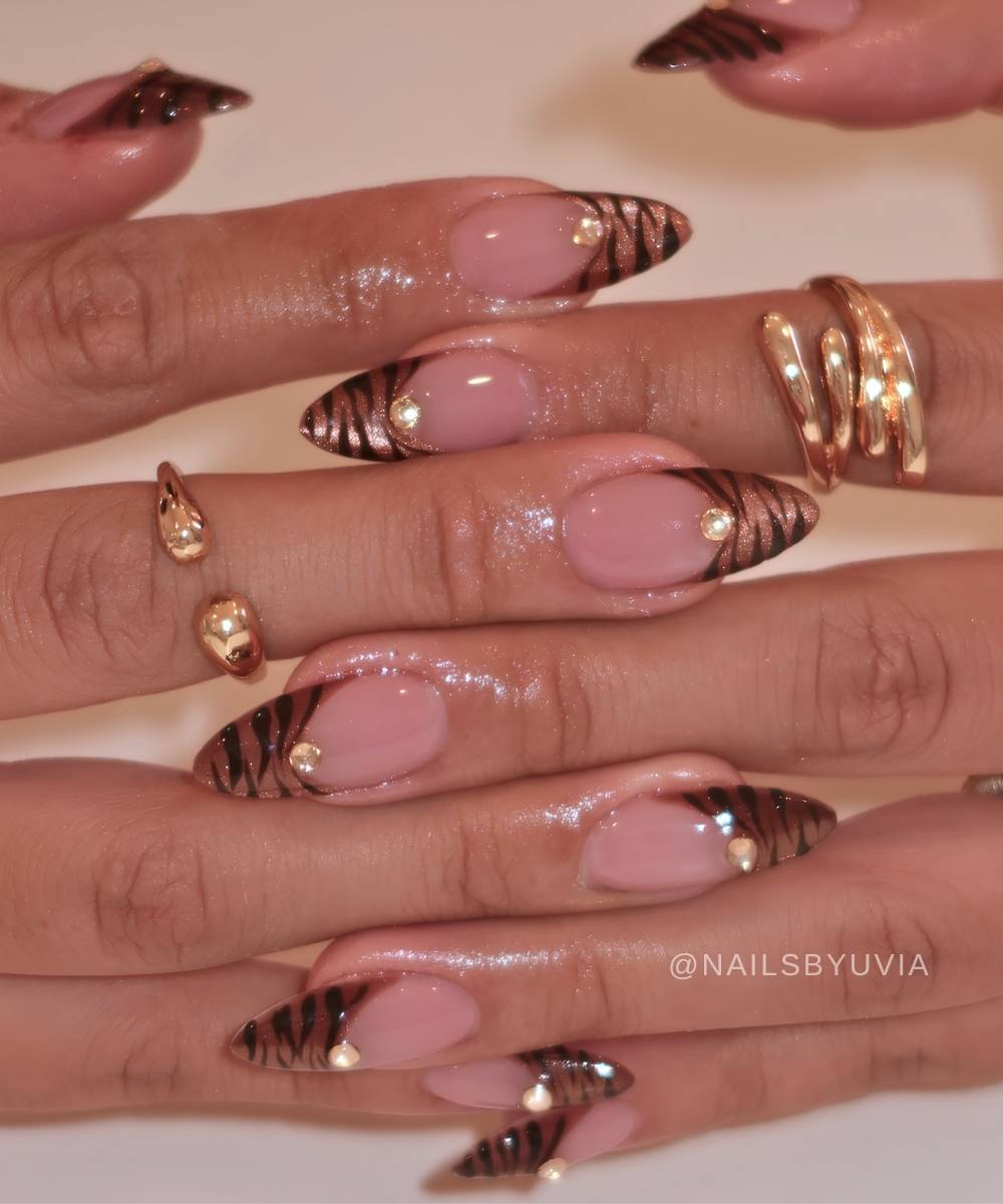 Brown cat eye tiger print French manicure
