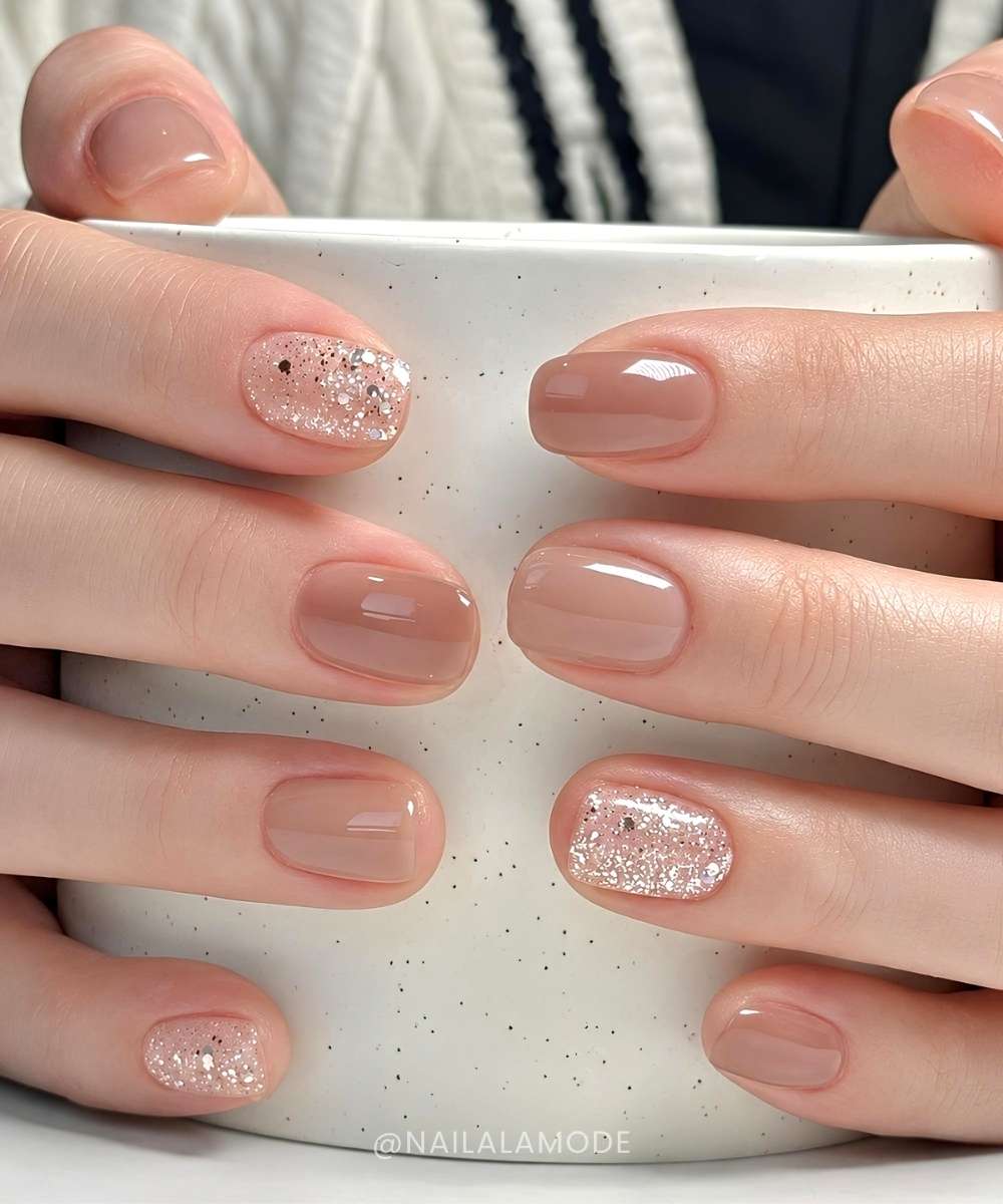 Brown nude nails with glitter accents