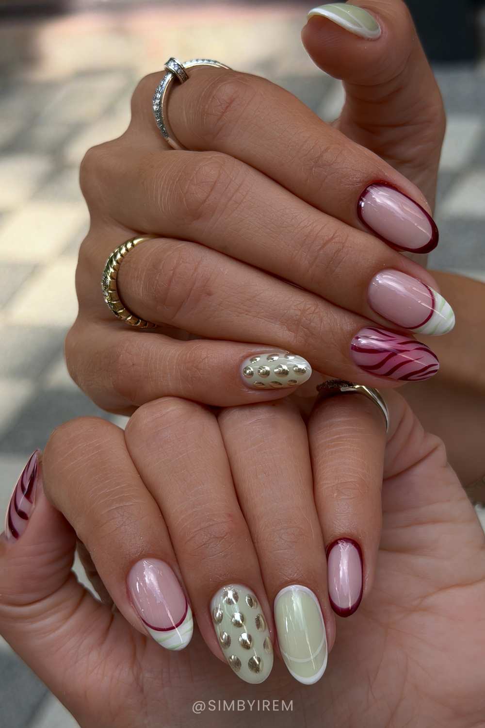 Burgundy and sage green nails with dots and animal print