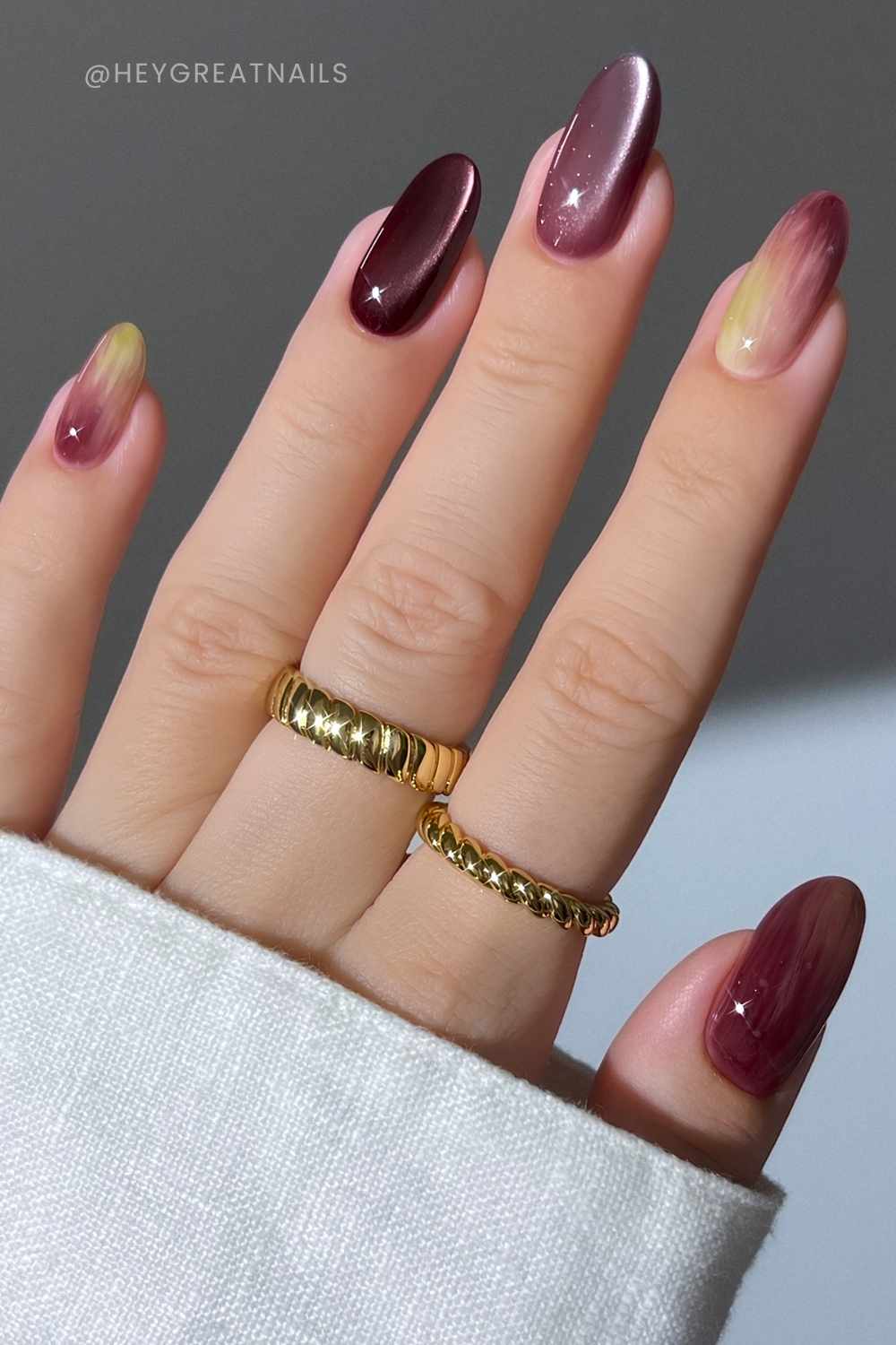Burgundy cat eye mani with olive green accents