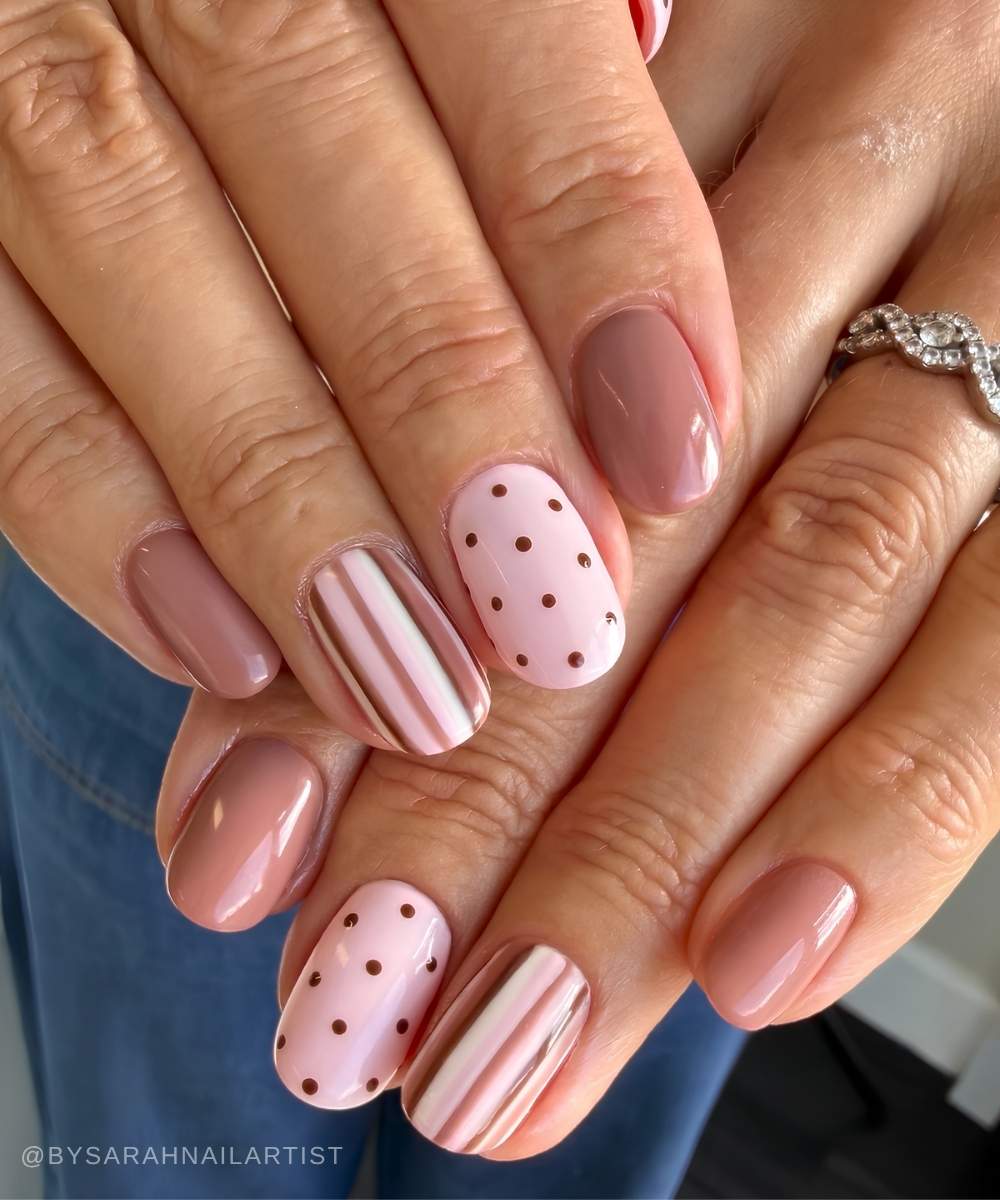 Dusty pink nails with dots and stripes