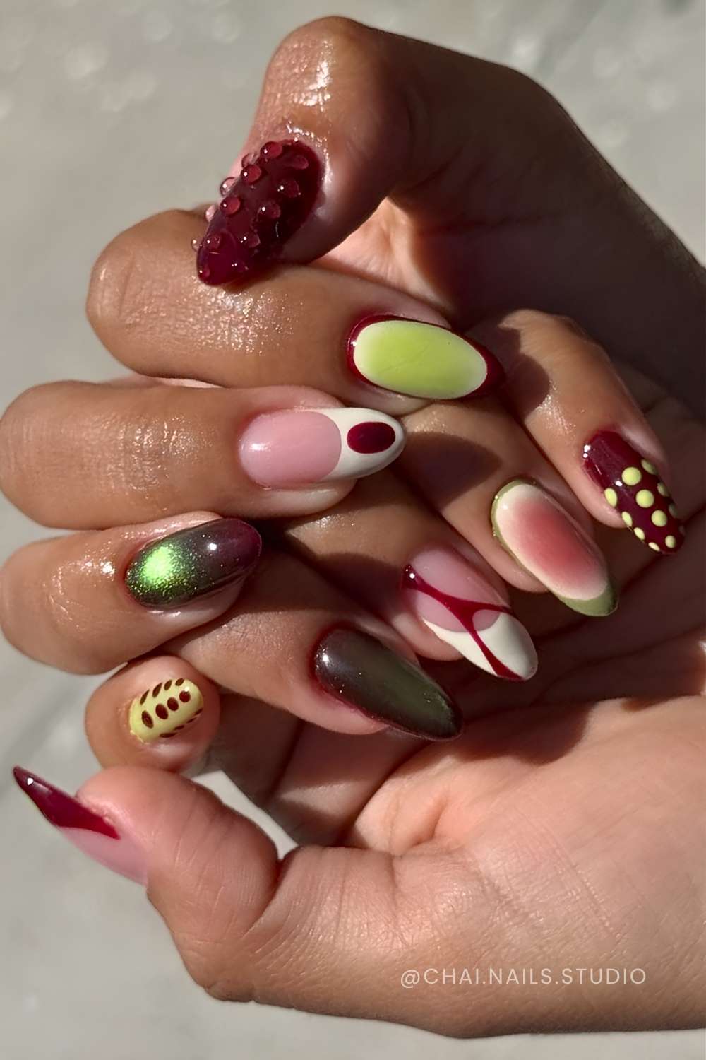 Green and burgundy mismatched nails