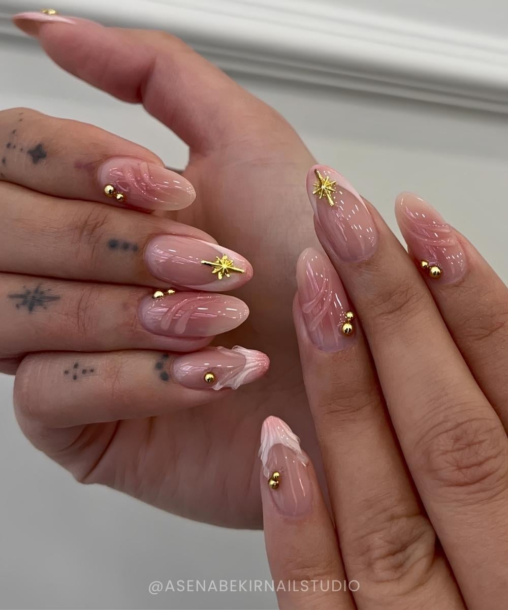 Nude nails with aura and celestial accents