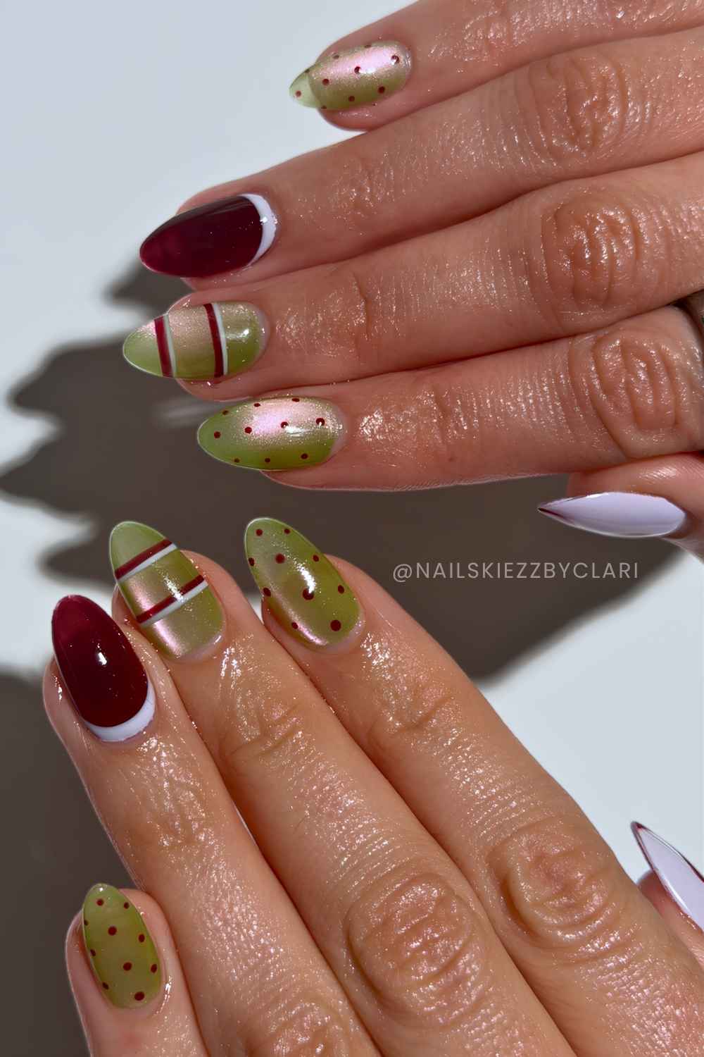 Olive and burgundy cat eye mani with stars and dots