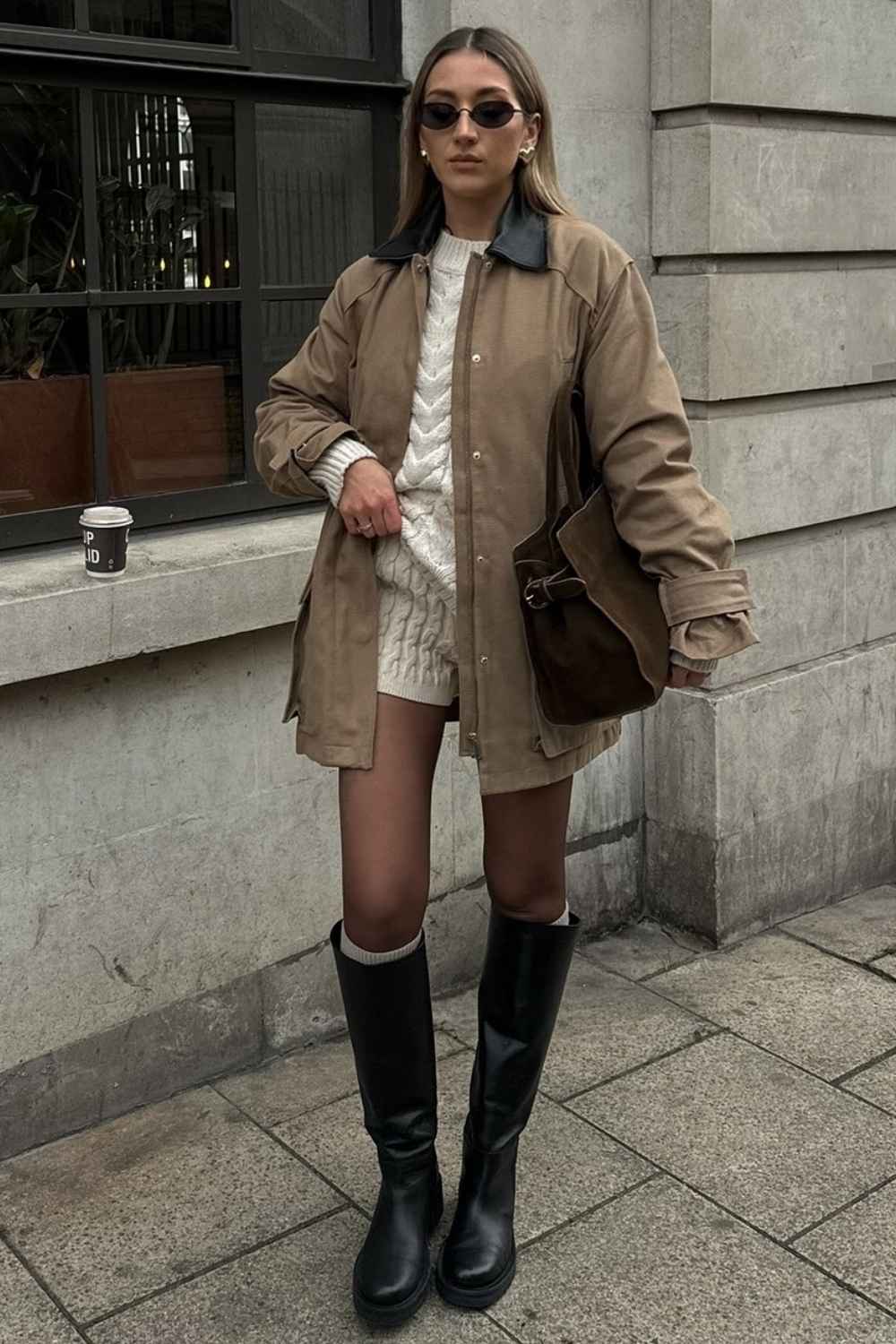 Oversized barn jacket with cable knit and black boots