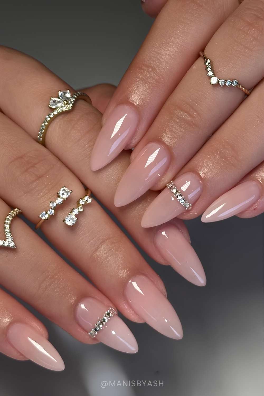 Pink nude nails with gem bangle art