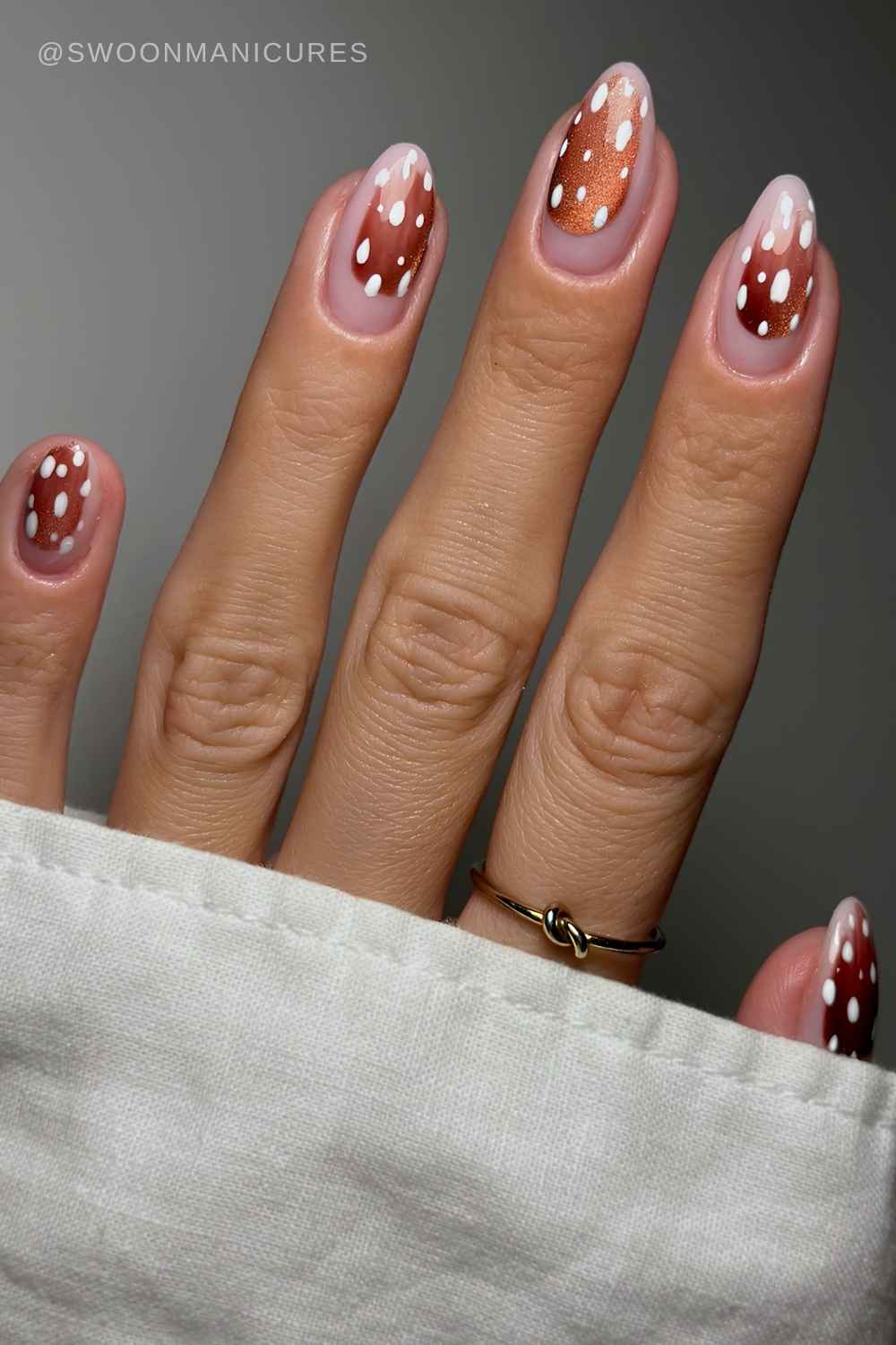 Sheer nails with brown cat eye deer print