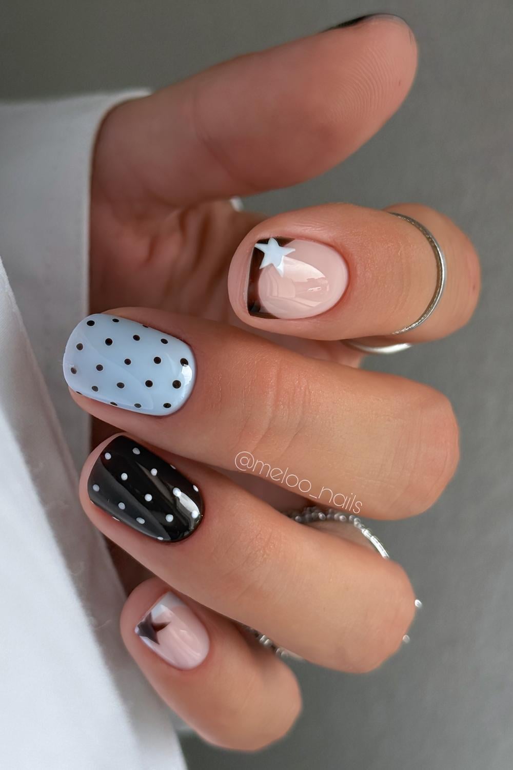 Short dark brown and blue nails with stars and dots