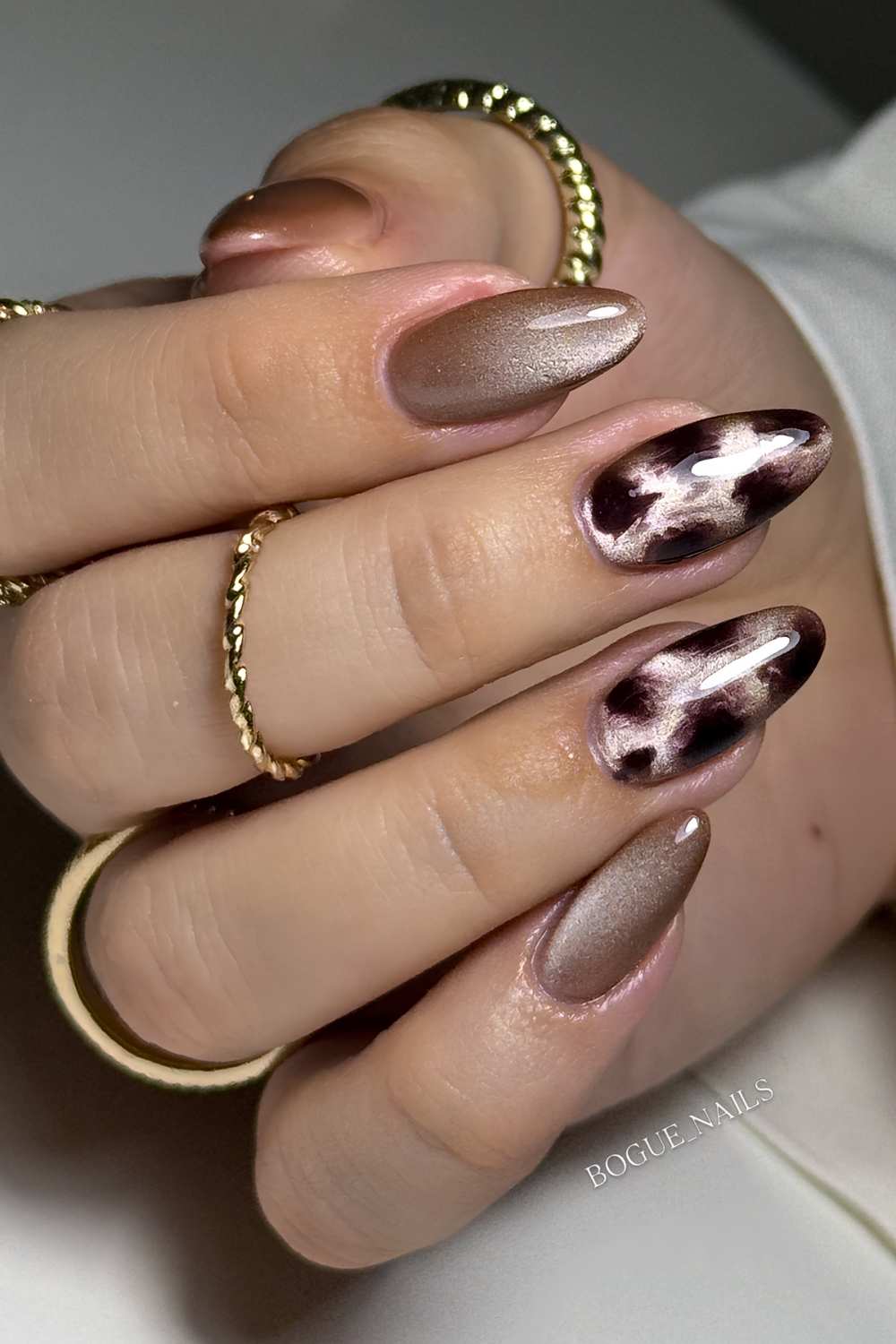 Taupe cat eye nails with animal print