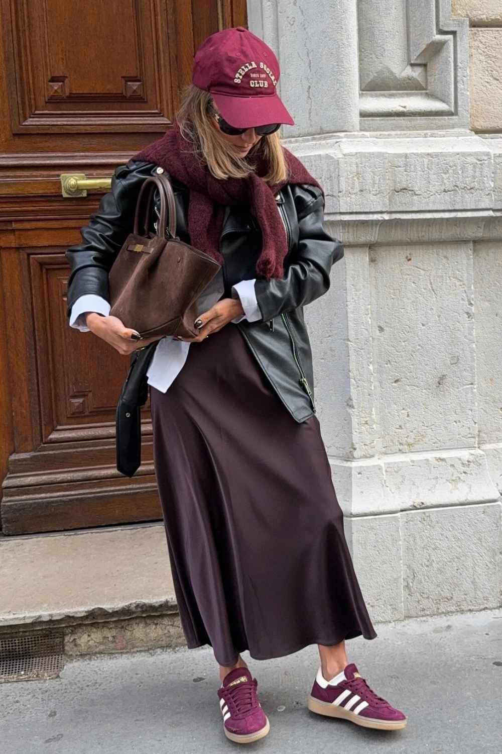 brown satin skirt with baseball cap and leather jacket