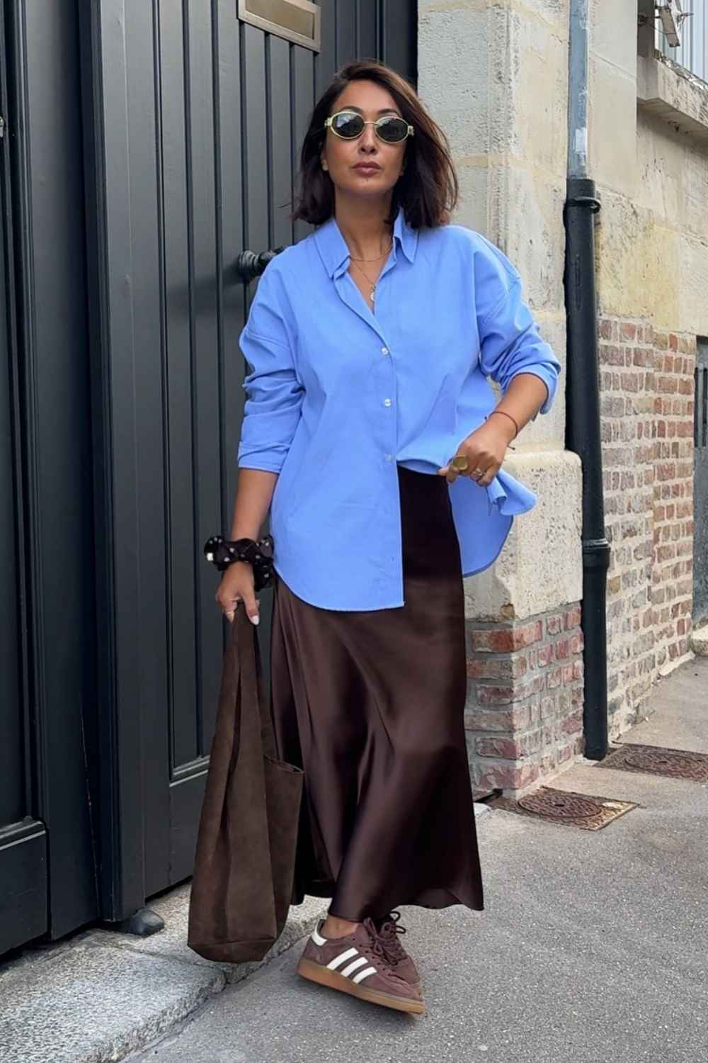 brown satin skirt with oversized blue shirt
