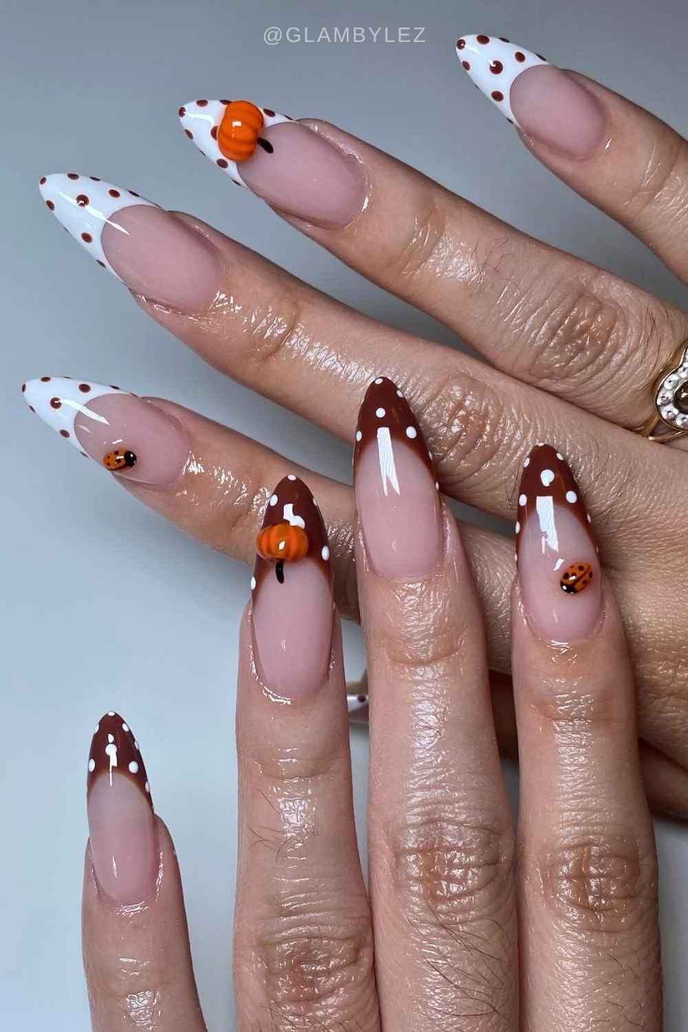 Brown and white French mani with pumpkins and polka dots