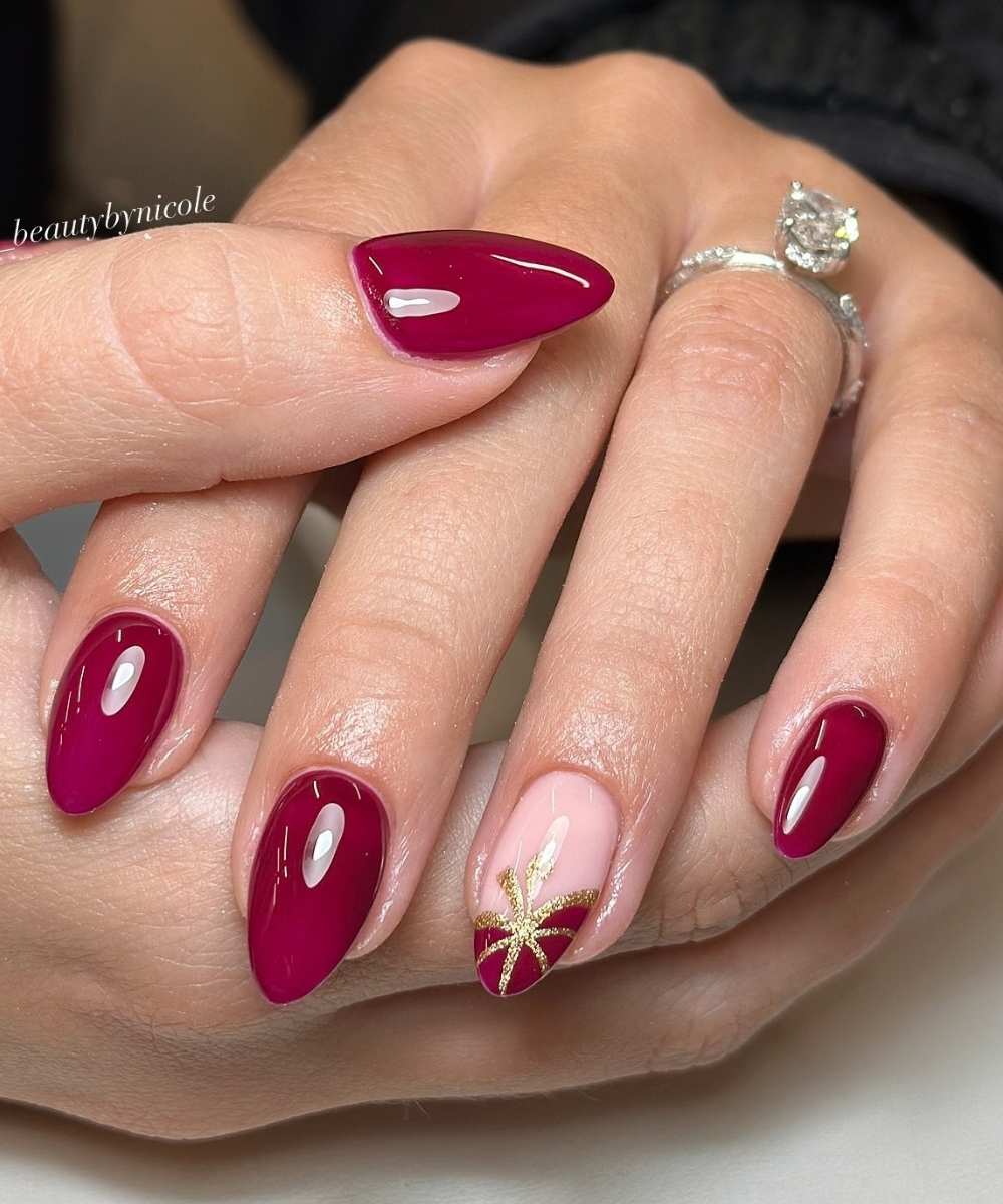 Cranberry red nails with pumpkin art