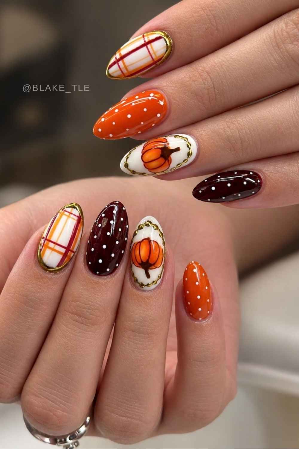 Earthy fall nails with pumpkins and mixed pattern art