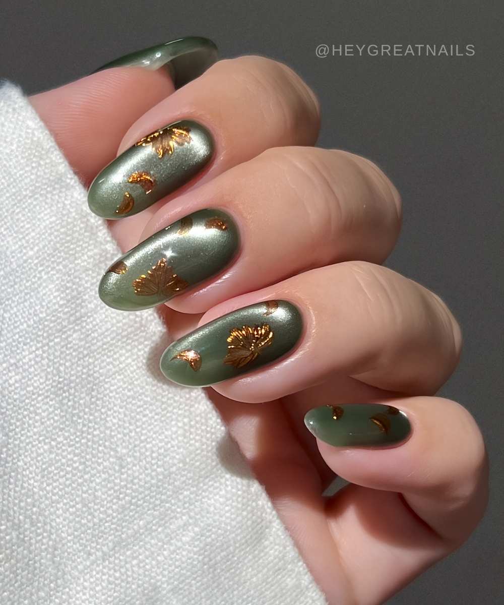 Green cat eye mani with bronze leaf art