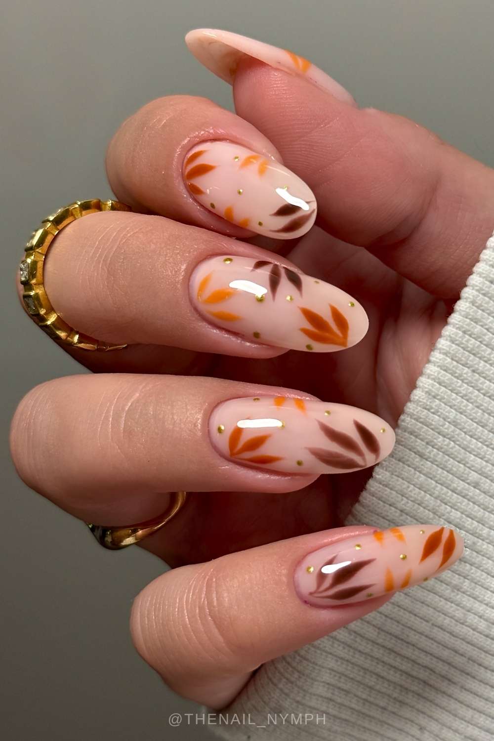 Milky nails with autumn leaf art