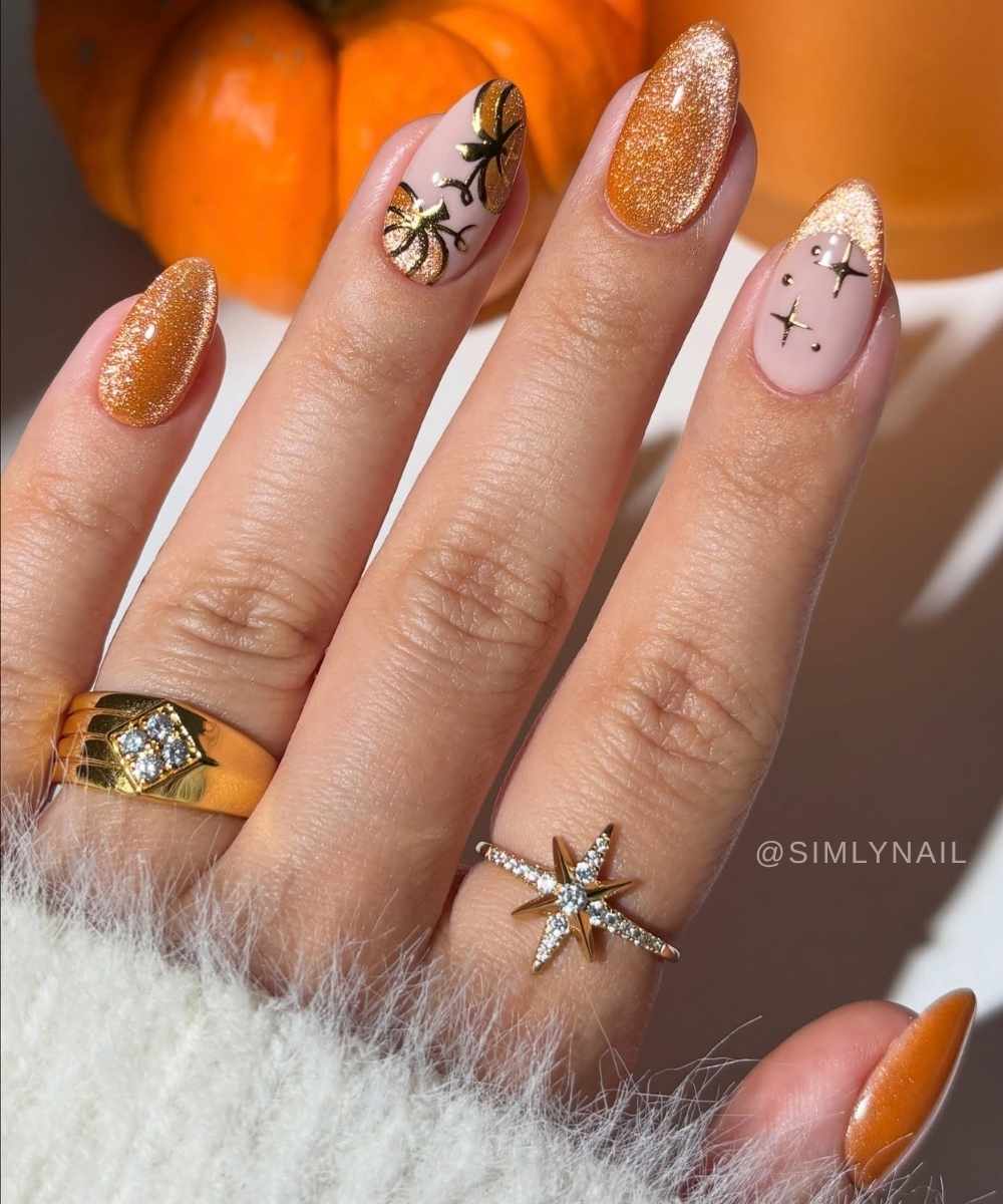 Orange velvet effect nails with pumpkins