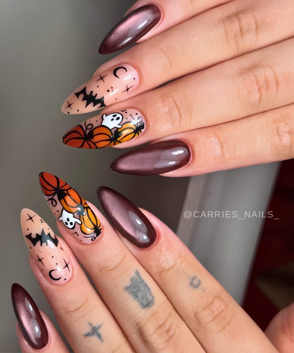 Plum cat eye nails with pumpkins and bats