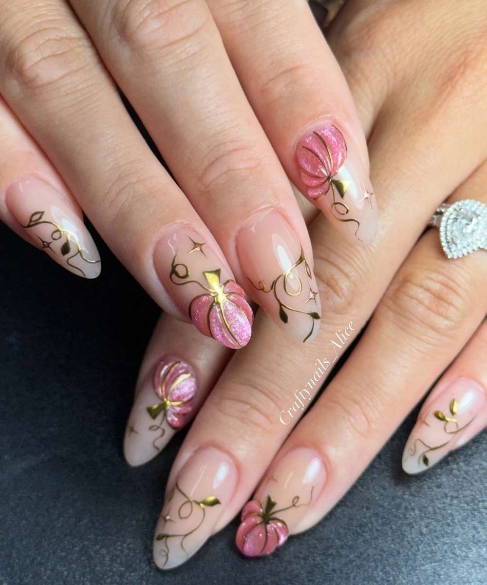 Sheer nails with pink pumpkin art