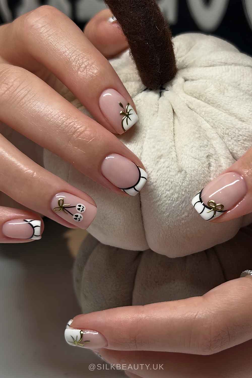 White French mani with pumpkin details